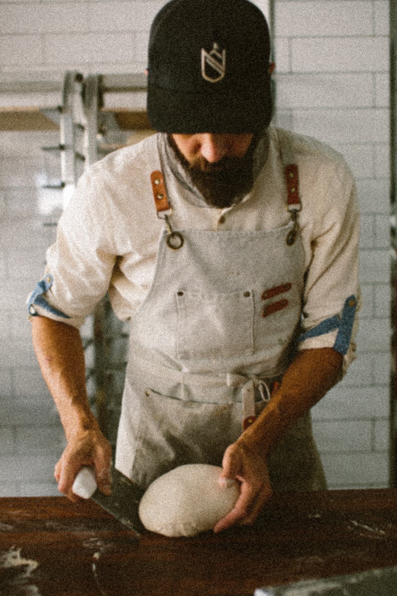 Baker shaping sourdough