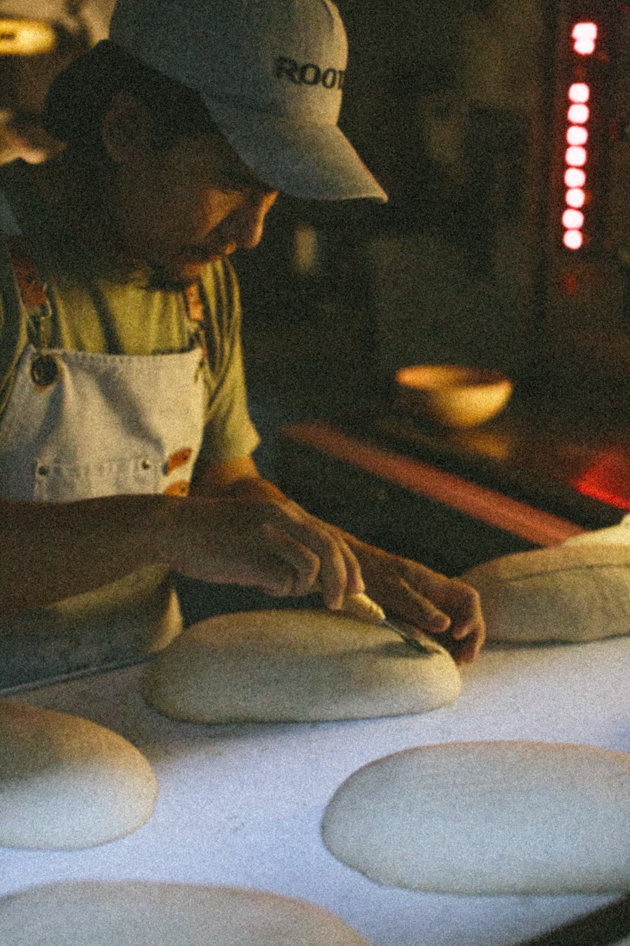 Baker working with dough
